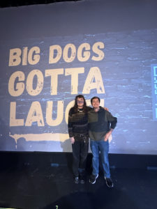 Willow Adamson (left) and Cooper Spacil (right) pose in front of the Big Dogs Gotta Laugh display